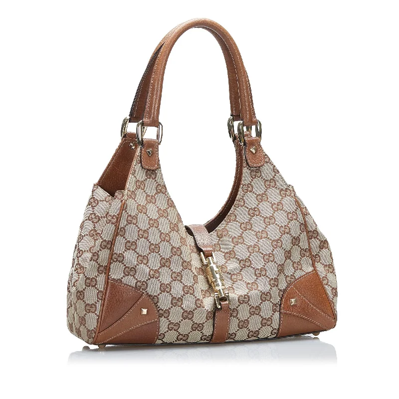 Women Gucci bags with a chain - link trim and a leather bodyGucci GG Canvas Nailhead Jackie (SHG-MytTQB)