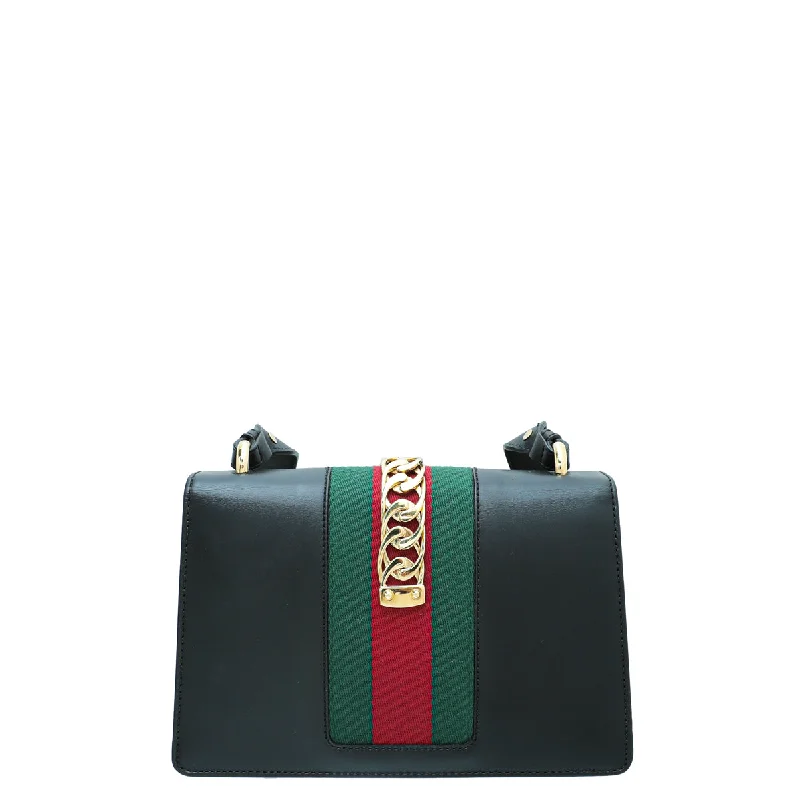 Women Gucci Sylvie bags with a monogram - embossed leatherGucci Black Sylvie Small Shoulder Bag