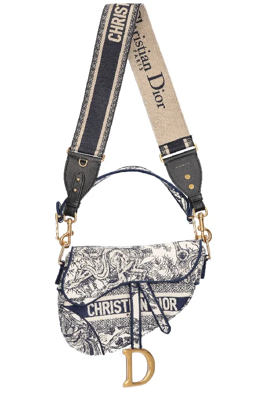 Christian Dior Saddle bags with a studded trim for a bold lookCHRISTIAN DIOR Saddle Bag Toile de Jouy