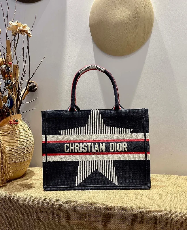 Christian Dior tote bags with a printed Dior logo on the frontChristian Dior MeChristian Diorum DYORAlps Book Tote Black