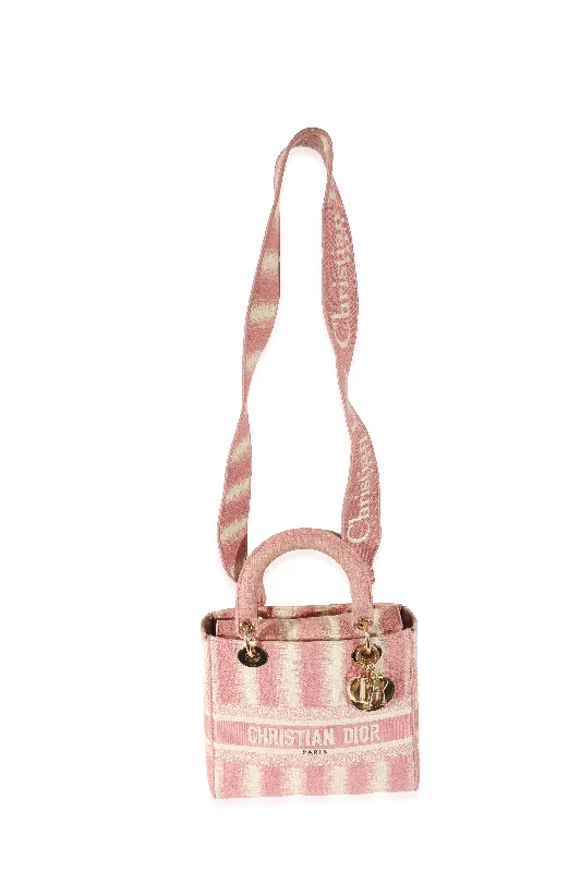 Contemporary Christian Dior handbags with a unique shapeCHRISTIAN DIOR Pink Canvas Medium D-Stripes Lady D-Lite