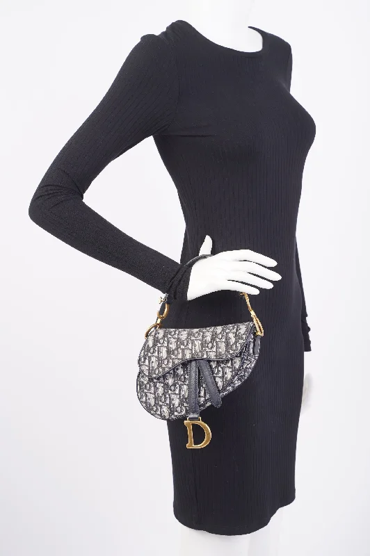 Stylish Christian Dior shoulder bags with a tassel - adorned zipperChristian Dior Saddle Bag Monogram / Navy Blue Canvas Mini